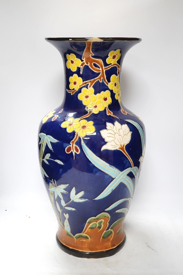 A South East Asian polychrome pottery vase and a Staffordshire pottery greyhound pen holder, vase 53cm high. Condition - vase fair, pen holder marks to glazing
